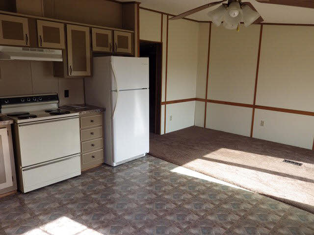 555 Madrid Road Waynesboro, VA 22980 - Photo 11 of 18 a kitchen with a refrigerator and a stove