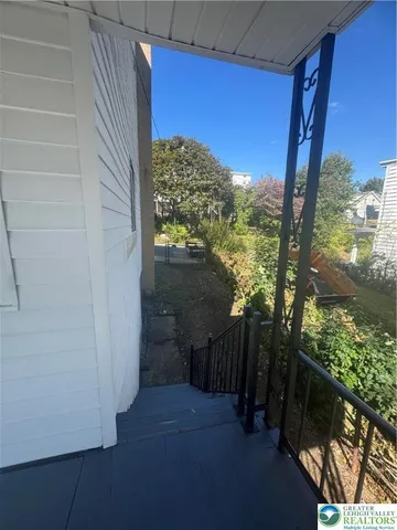 a view of a yard from a balcony