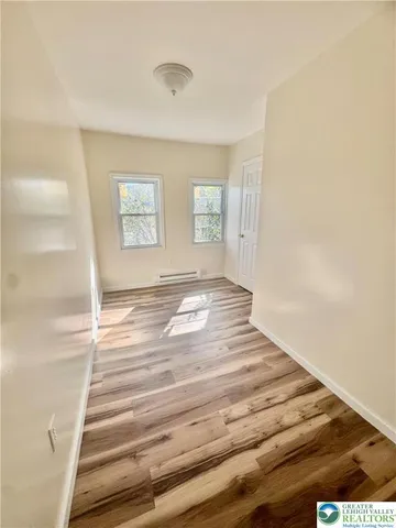 a view of wooden floor and staircase
