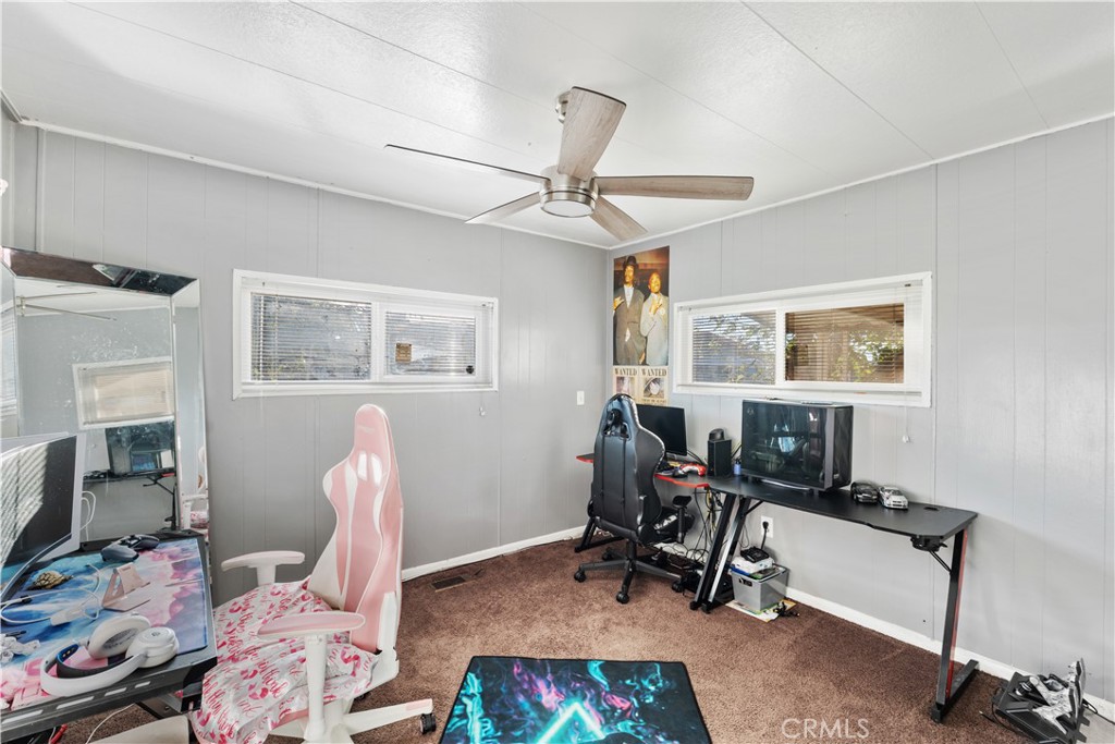 1000 Windy Pass, Unit 146 Barstow, CA 92311 - Photo 11 of 29 a view of a workspace with furniture and a window