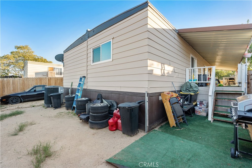 1000 Windy Pass, Unit 146 Barstow, CA 92311 - Photo 22 of 29 a view of a garage with a table and chairs