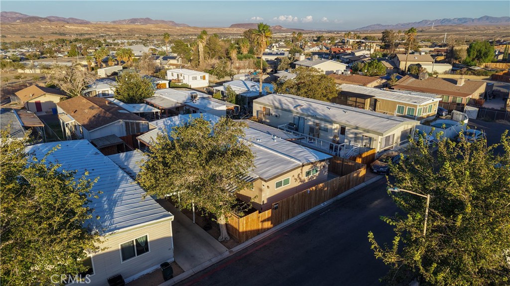 1000 Windy Pass, Unit 146 Barstow, CA 92311 - Photo 27 of 29 an aerial view of residential houses with outdoor space and trees