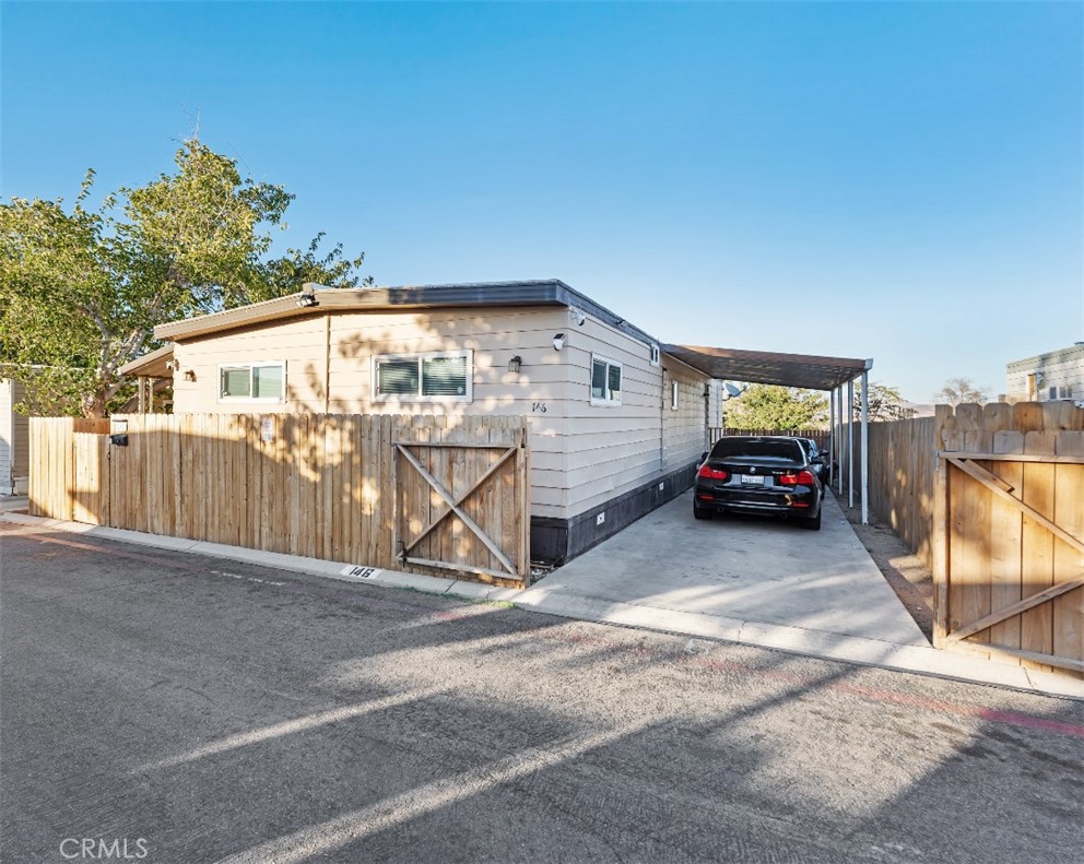 1000 Windy Pass, Unit 146 Barstow, CA 92311 - Photo 29 of 29 a view of a car park in front of house