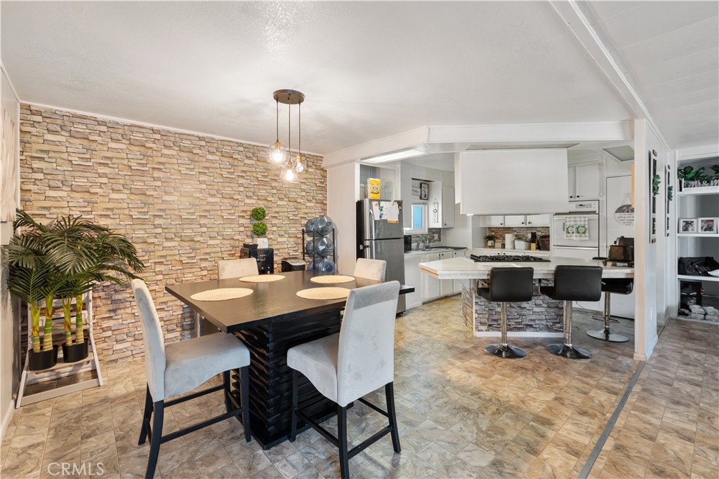 1000 Windy Pass, Unit 146 Barstow, CA 92311 - Photo 6 of 29 a view of a dining room with furniture