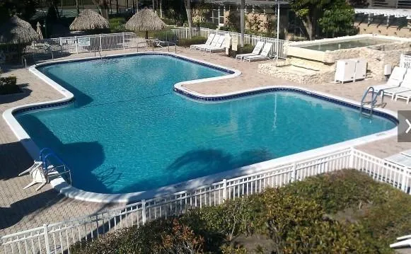 a view of a swimming pool with a patio