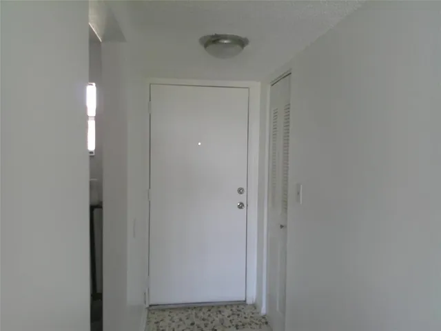 a view of a room that has a door in it