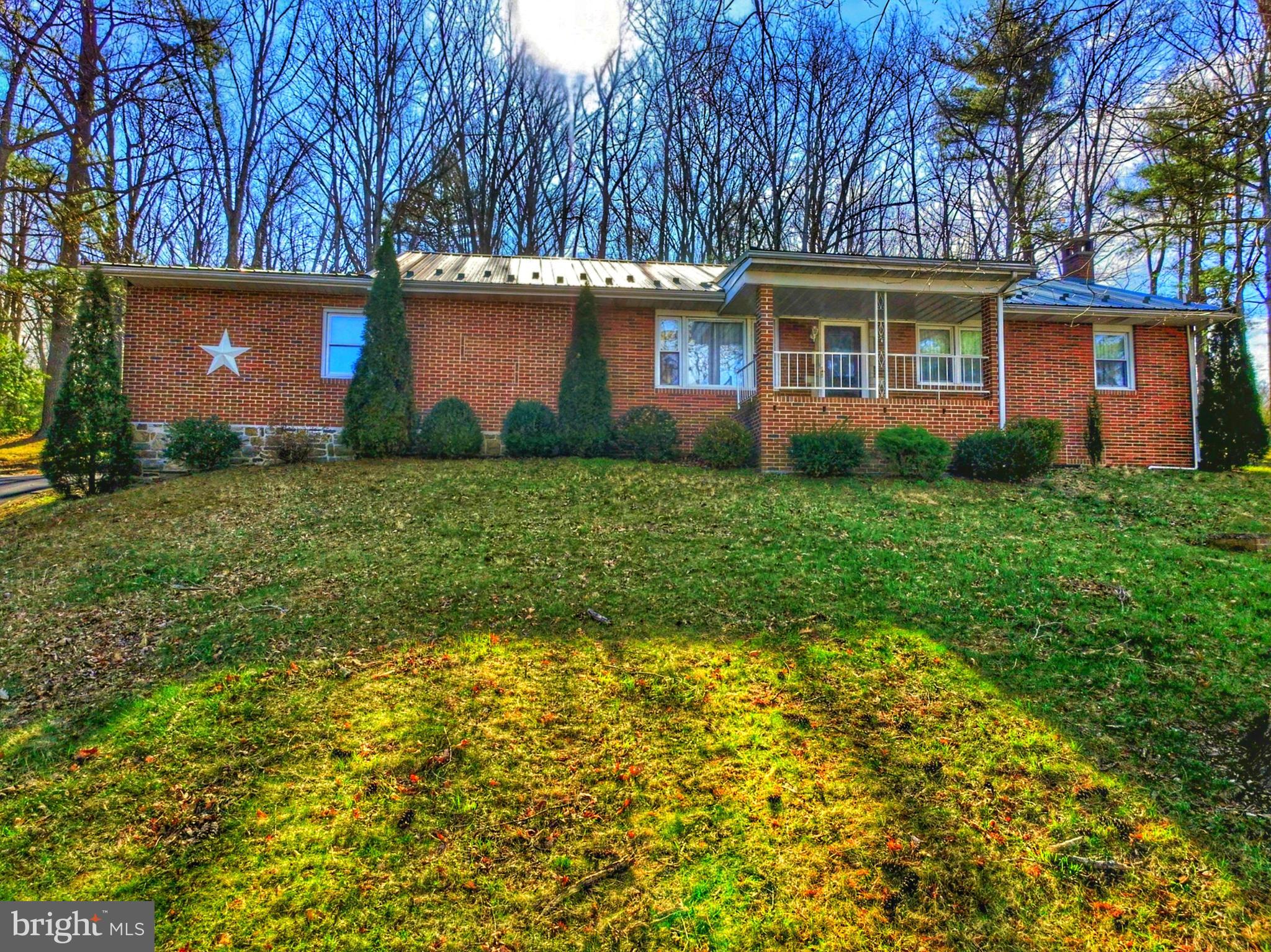 a view of a house with a backyard