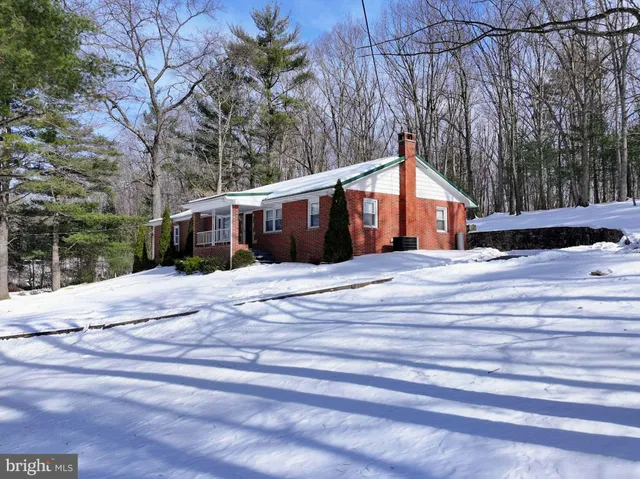a kitchen with granite countertop a refrigerator and a stove top oven