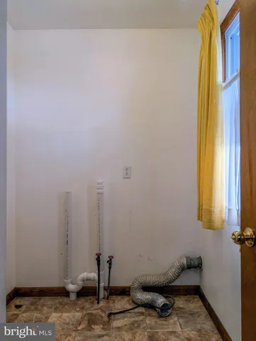 a view of a room with a wooden walls