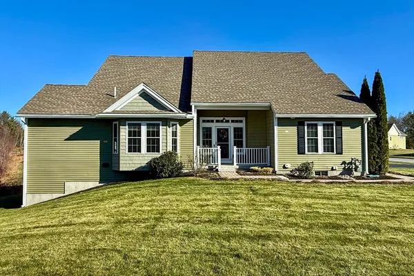 a front view of a house with a yard