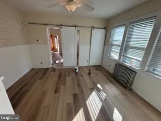 a view of front door with wooden floor