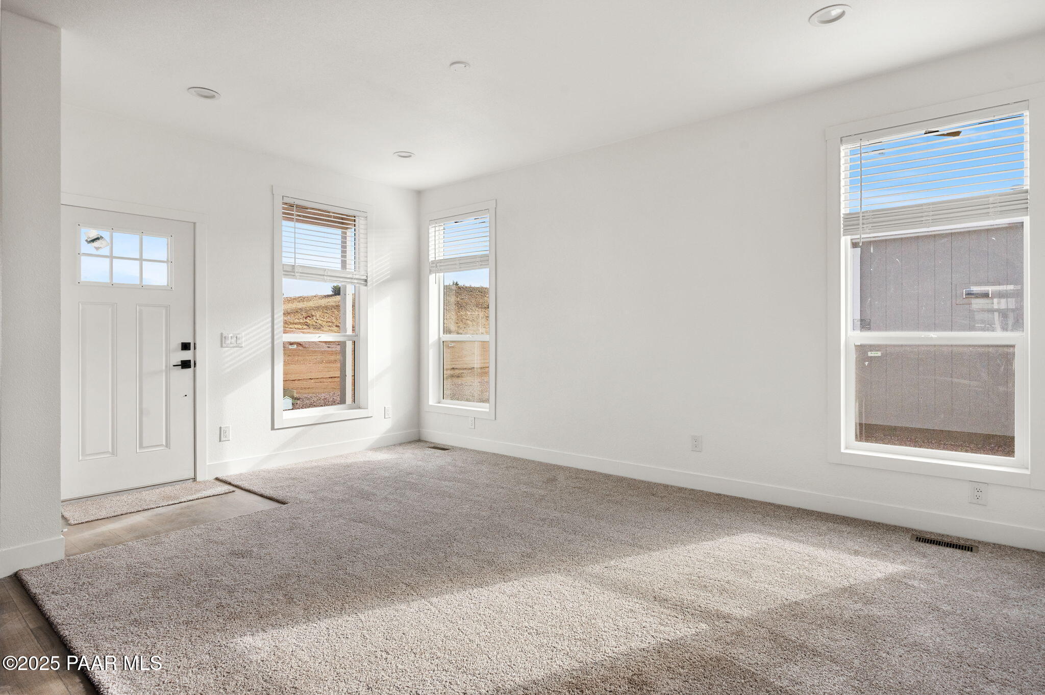 29 East Abra Road Paulden, AZ 86334 - Photo 4 of 22 an empty room with windows