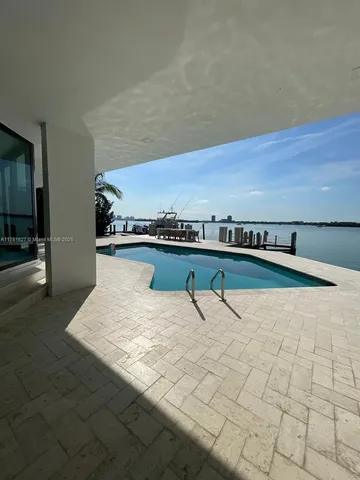 a view of swimming pool with a yard