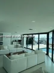 a view of water heater room with large windows