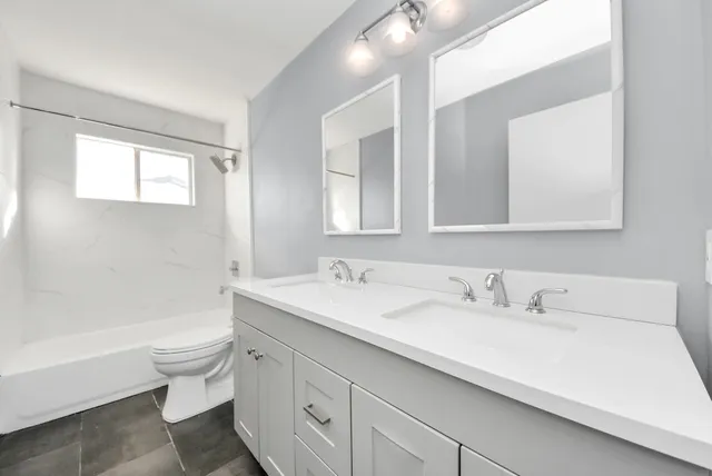 a bathroom with a sink a toilet and a bathtub