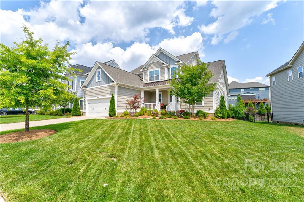 5409 Meadowcroft Way Fort Mill, SC 29708 - Photo 1 of 34 a front view of a house with yard and green space