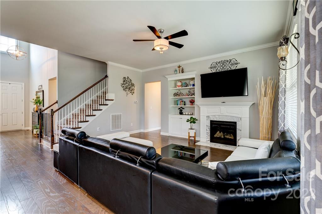 5409 Meadowcroft Way Fort Mill, SC 29708 - Photo 11 of 34 a living room with furniture pool fireplace and a flat screen tv