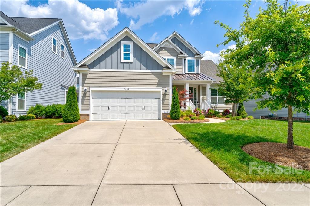 5409 Meadowcroft Way Fort Mill, SC 29708 - Photo 2 of 34 a front view of a house with a yard