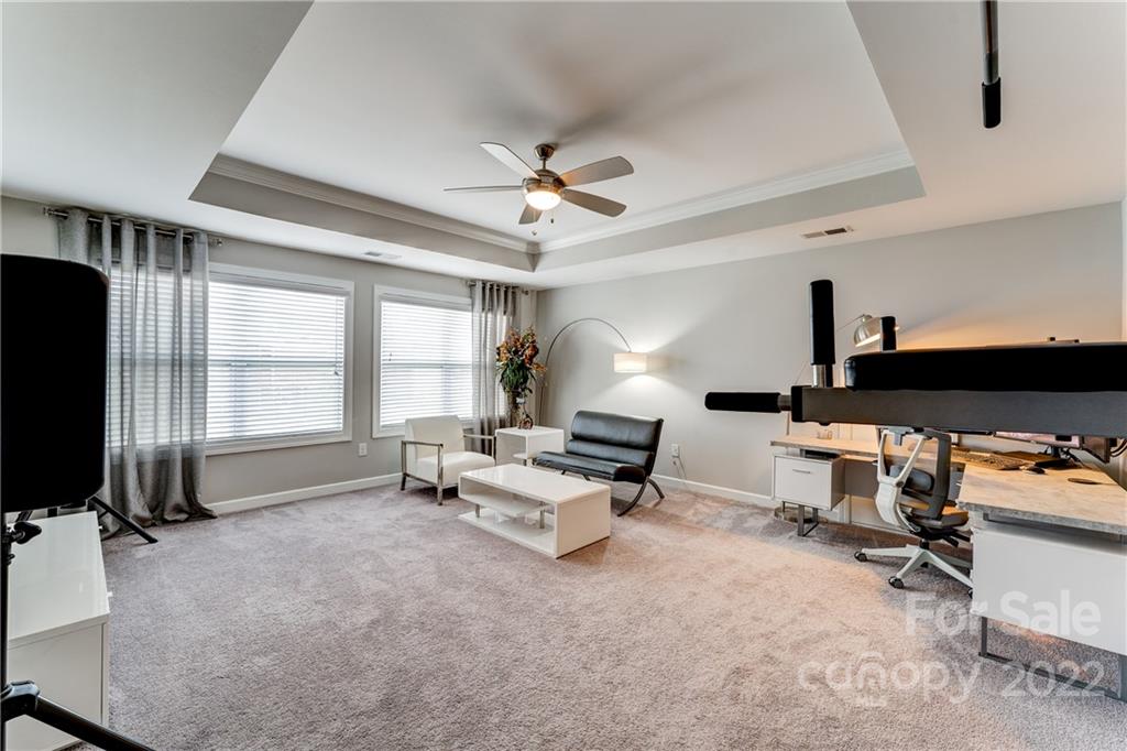 5409 Meadowcroft Way Fort Mill, SC 29708 - Photo 23 of 34 a living room with furniture a window and a flat screen tv