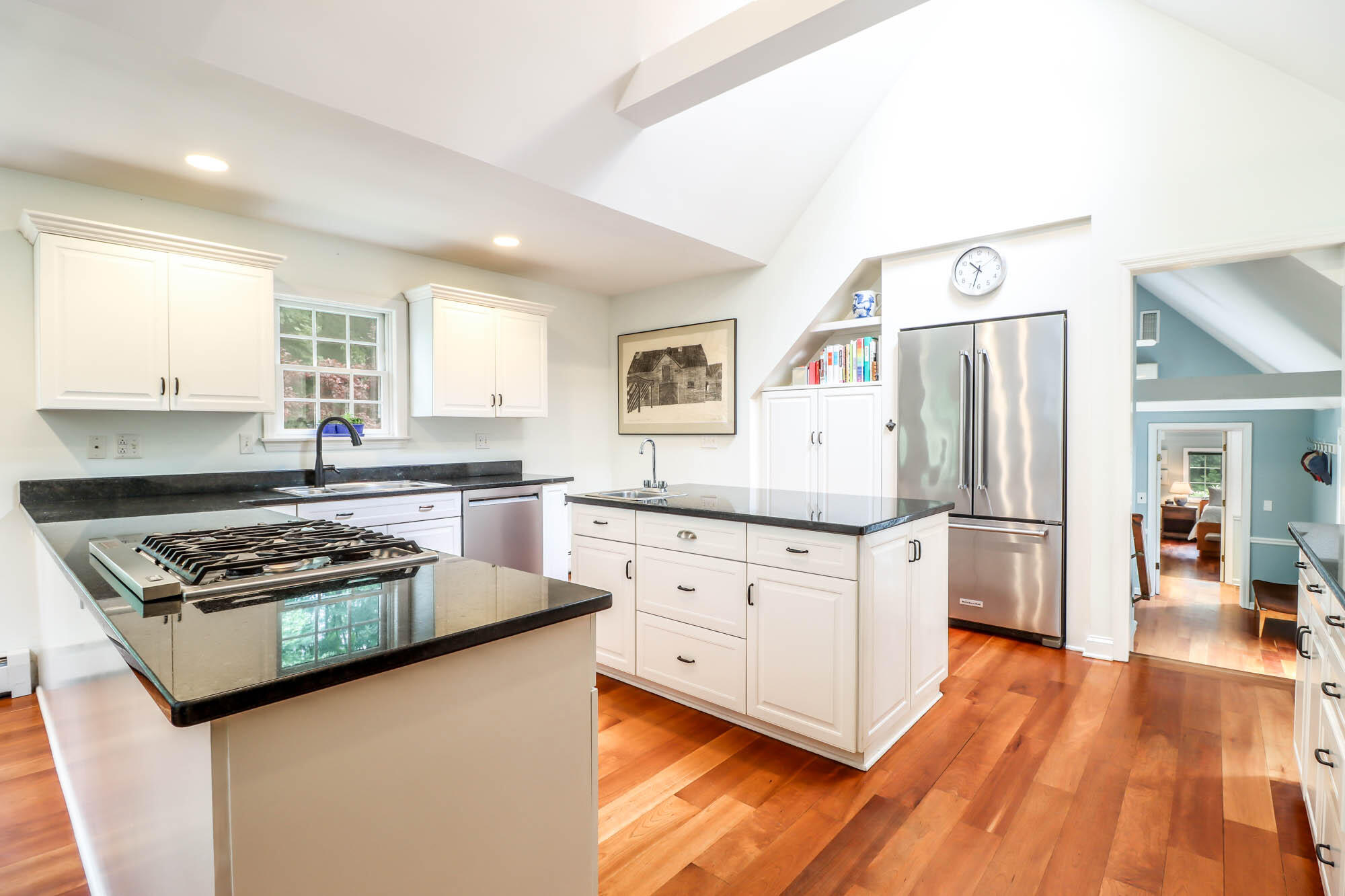 262 White Oak Shade Road New Canaan, CT 06840 - Photo 16 of 37 a kitchen with stainless steel appliances granite countertop a stove a sink dishwasher and a refrigerator