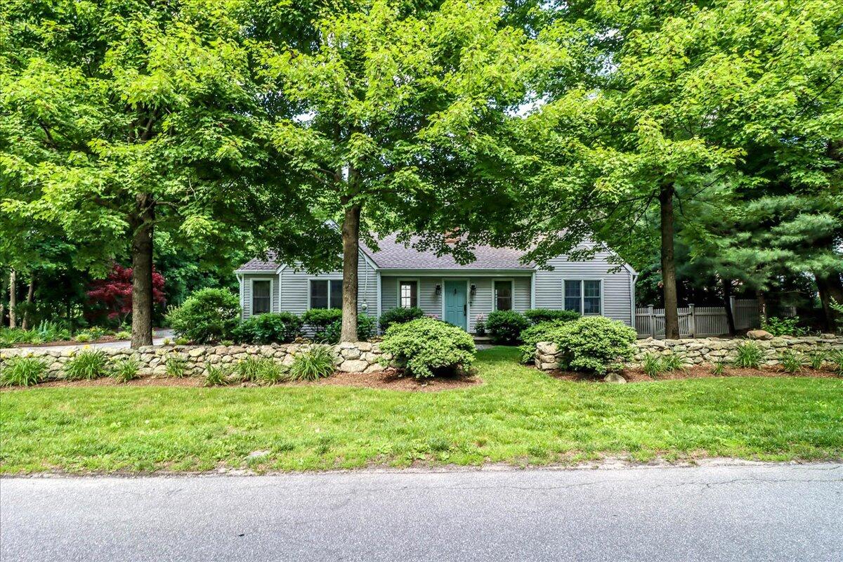 262 White Oak Shade Road New Canaan, CT 06840 - Photo 2 of 37 a front view of house with yard and green space