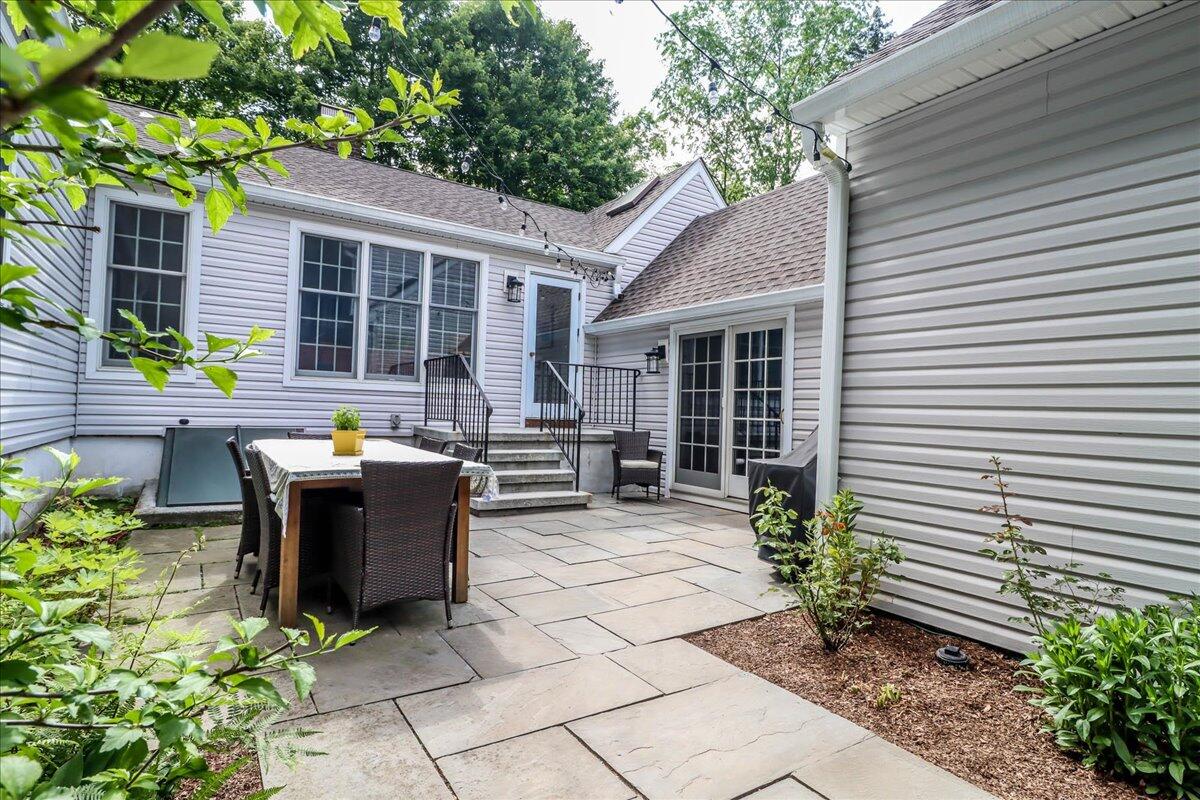262 White Oak Shade Road New Canaan, CT 06840 - Photo 34 of 37 a view of a patio with chairs and potted plants