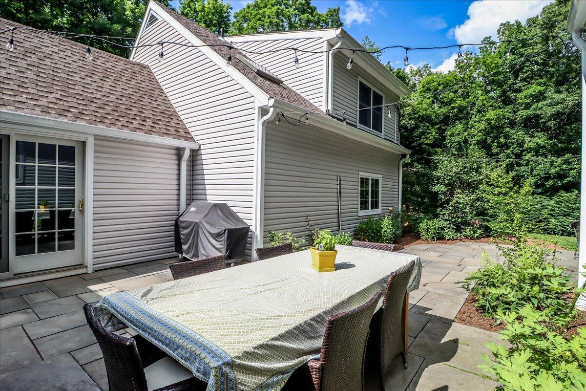 262 White Oak Shade Road New Canaan, CT 06840 - Photo 35 of 37 a view of a patio with table and chairs and potted plants