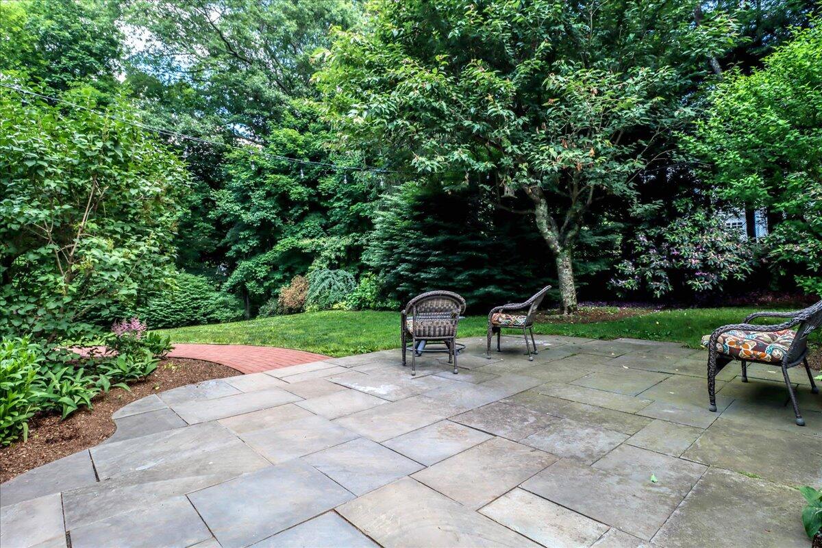 262 White Oak Shade Road New Canaan, CT 06840 - Photo 36 of 37 a view of a bench in the garden