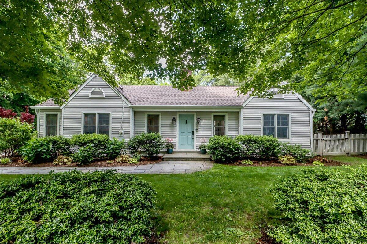 262 White Oak Shade Road New Canaan, CT 06840 - Photo 4 of 37 a front view of house with yard and green space