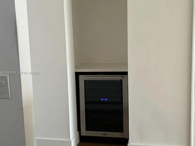 a view of a bedroom with washer and dryer