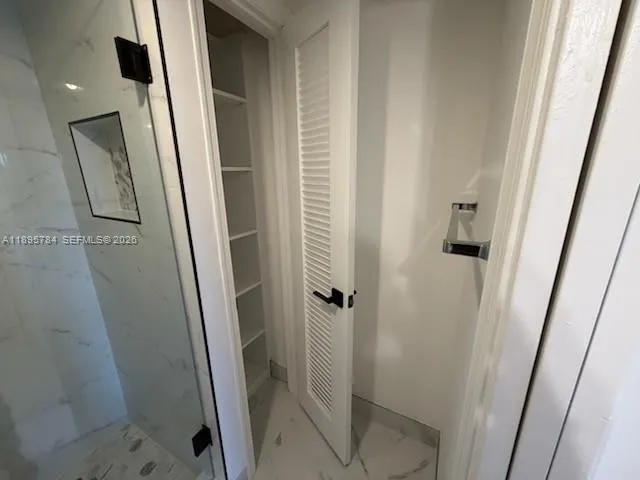 a view of swimming pool with outdoor seating and plants