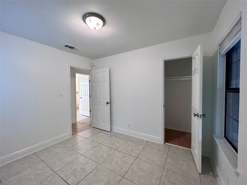 6200 Palm Circle Austin, TX 78741 - Photo 17 of 18 wooden floor in an empty room with a window
