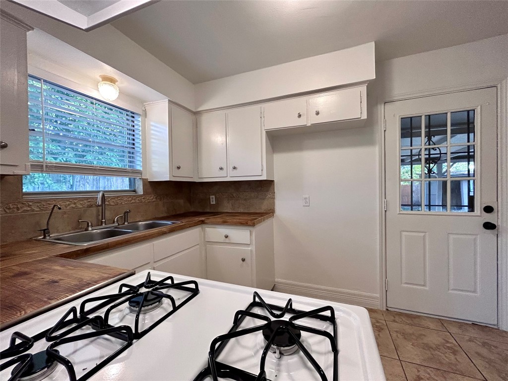 6200 Palm Circle Austin, TX 78741 - Photo 6 of 18 a kitchen with a sink appliances cabinets and a window