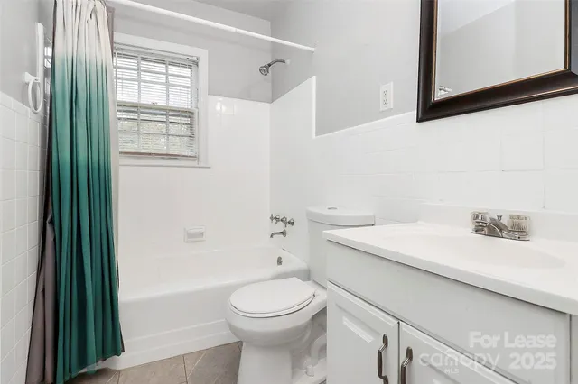 a bathroom with a sink a toilet and a bathtub
