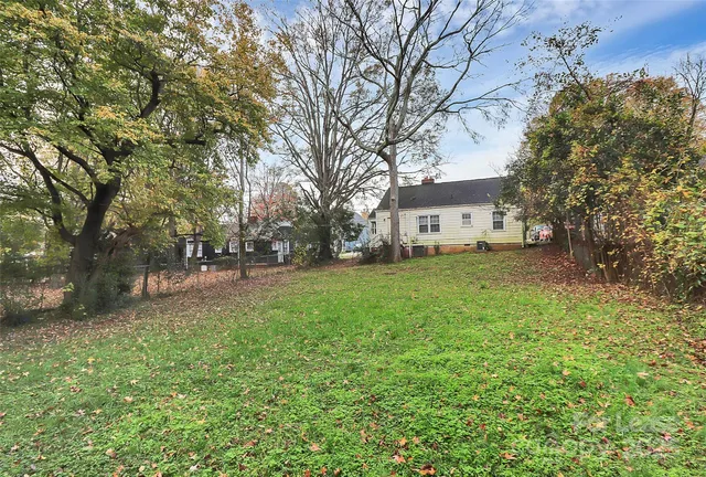 a view of a house with a back yard