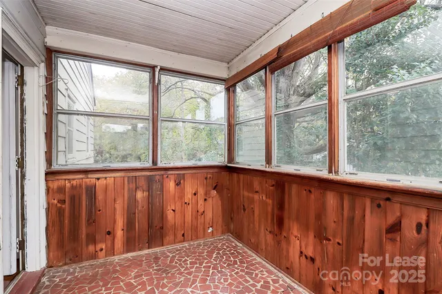 a view of balcony with wooden floor