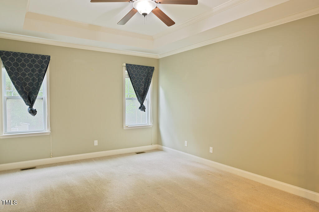 337 Shadowdale Lane Rolesville, NC 27571 - Photo 20 of 74 an empty room with a window and ceiling fan