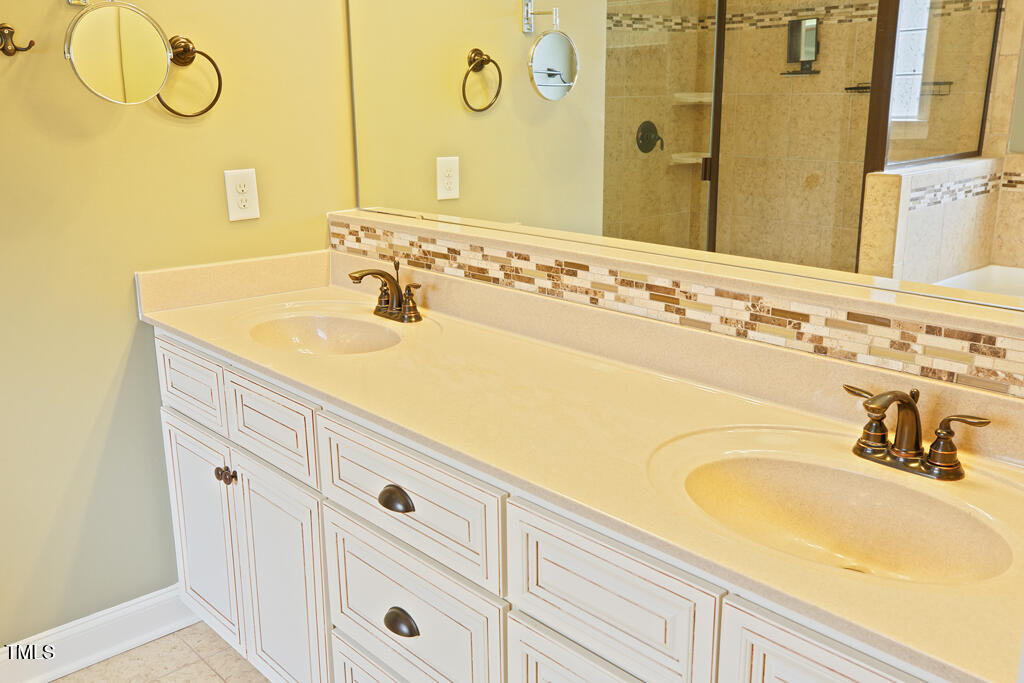 337 Shadowdale Lane Rolesville, NC 27571 - Photo 23 of 74 a bathroom with a sink and a mirror