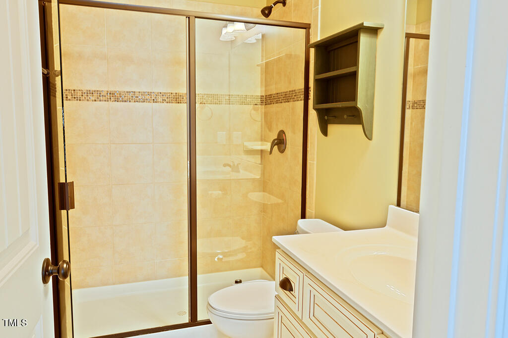 337 Shadowdale Lane Rolesville, NC 27571 - Photo 24 of 74 a bathroom with a granite countertop sink toilet and shower