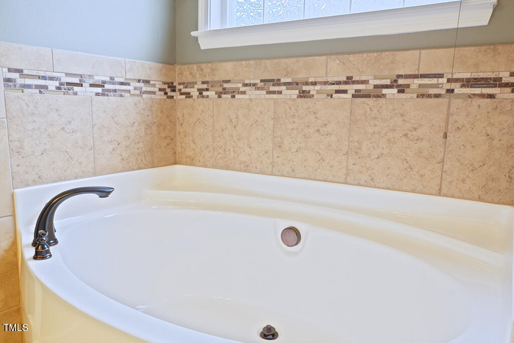 337 Shadowdale Lane Rolesville, NC 27571 - Photo 25 of 74 a bathroom with a bathtub