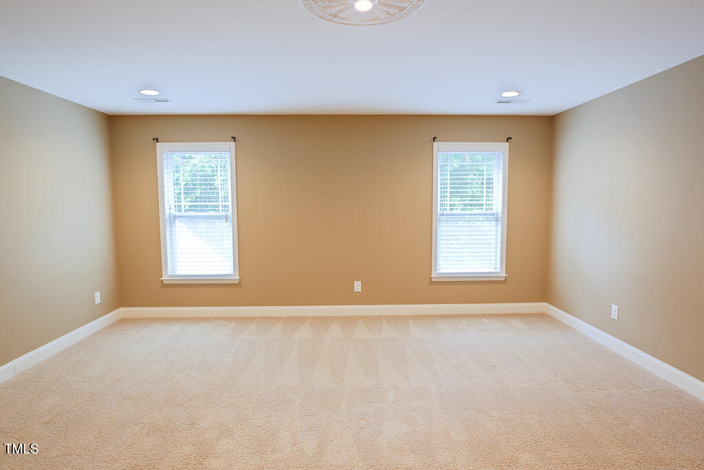 337 Shadowdale Lane Rolesville, NC 27571 - Photo 27 of 74 an empty room with windows