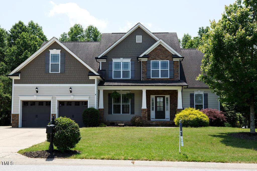 337 Shadowdale Lane Rolesville, NC 27571 - Photo 3 of 74 a front view of a house with a yard and garage