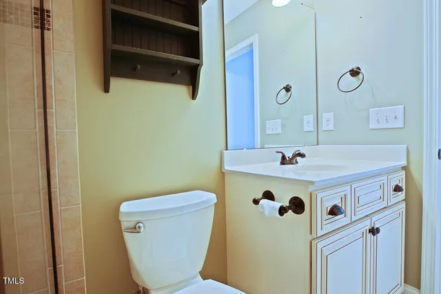 a view of a hallway with wooden shelves