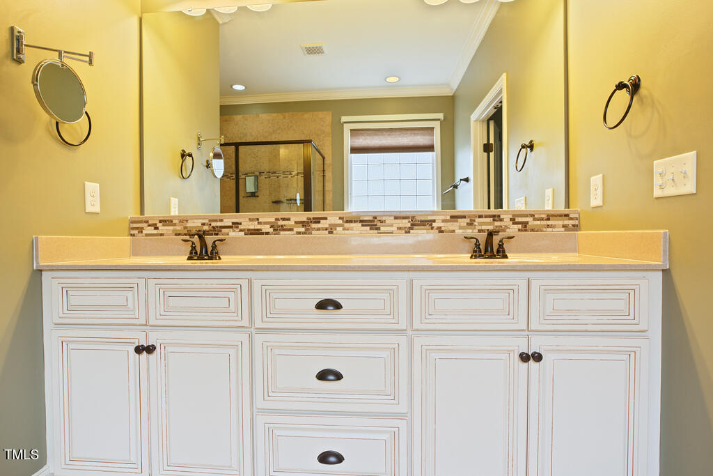 337 Shadowdale Lane Rolesville, NC 27571 - Photo 38 of 74 a bathroom with a sink and a mirror