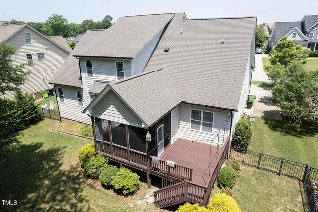 a aerial view of a house with a yard