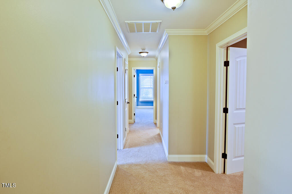337 Shadowdale Lane Rolesville, NC 27571 - Photo 49 of 74 a view of a hallway with wooden shelves
