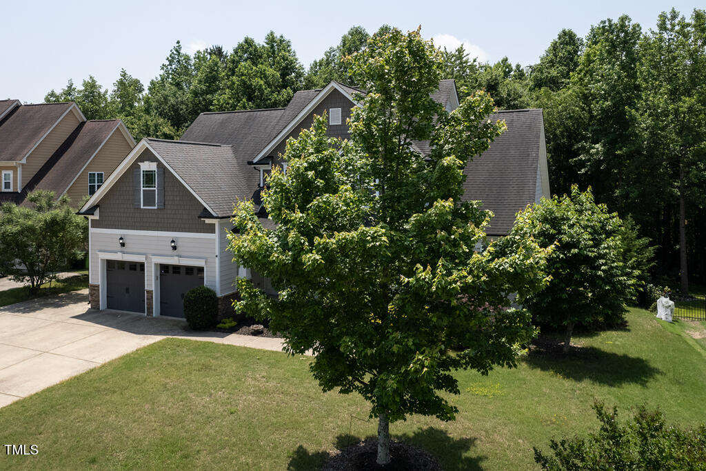 337 Shadowdale Lane Rolesville, NC 27571 - Photo 70 of 74 a front view of a house with a garden