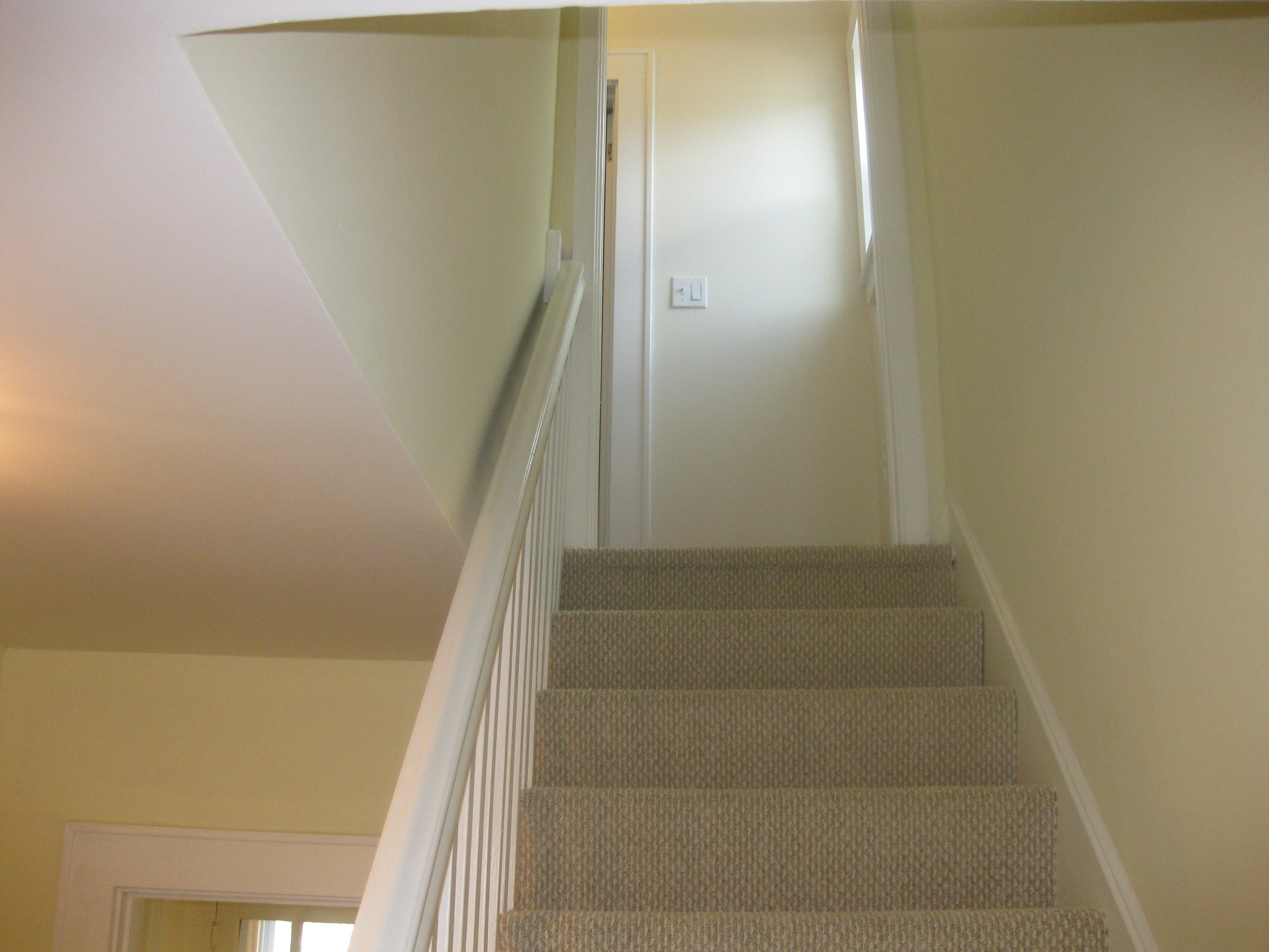 9 Joseph Street Darien, CT 06820 - Photo 13 of 18 a view of staircase with white walls and white door