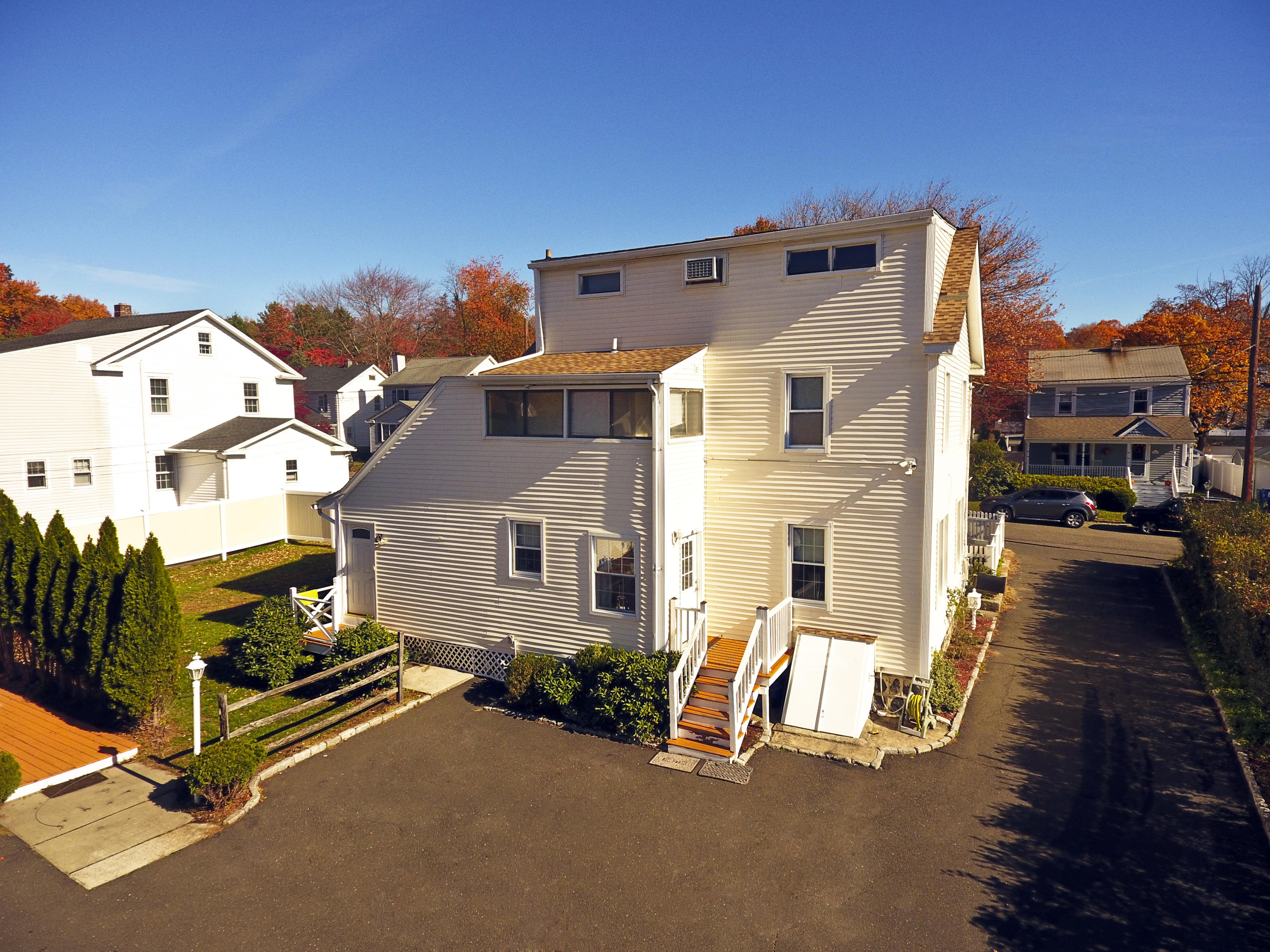 9 Joseph Street Darien, CT 06820 - Photo 2 of 18 a view of a house with many windows