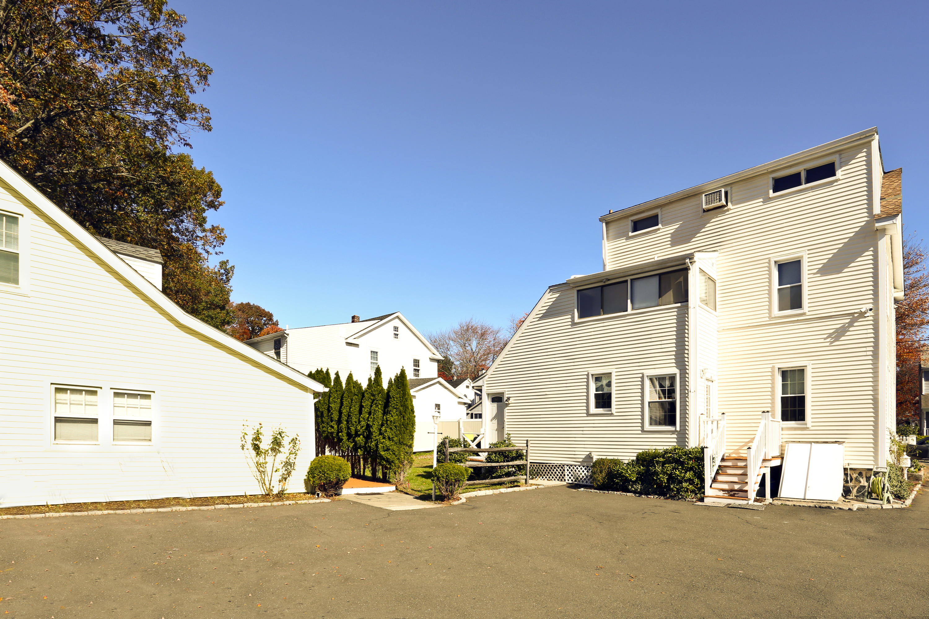 9 Joseph Street Darien, CT 06820 - Photo 7 of 18 a view of a white building with large windows